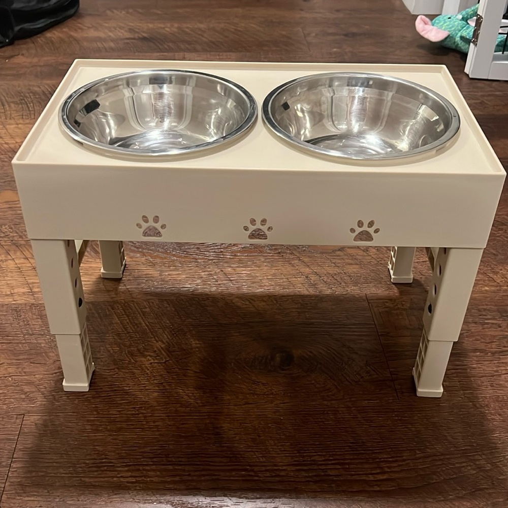 Cream Colored Dog Feeder and Bowls